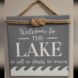 Gray and White Lake Welcome Sign